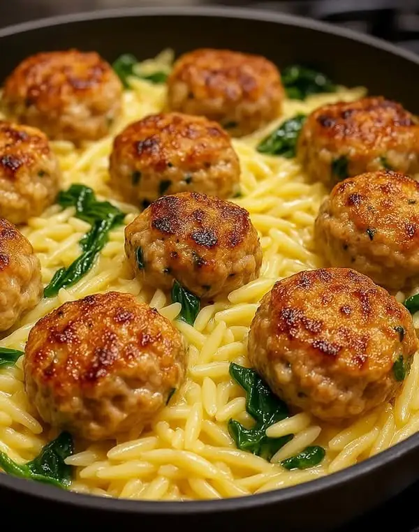 Lemony Chicken Ricotta Meatballs Over Garlic Spinach Orzo